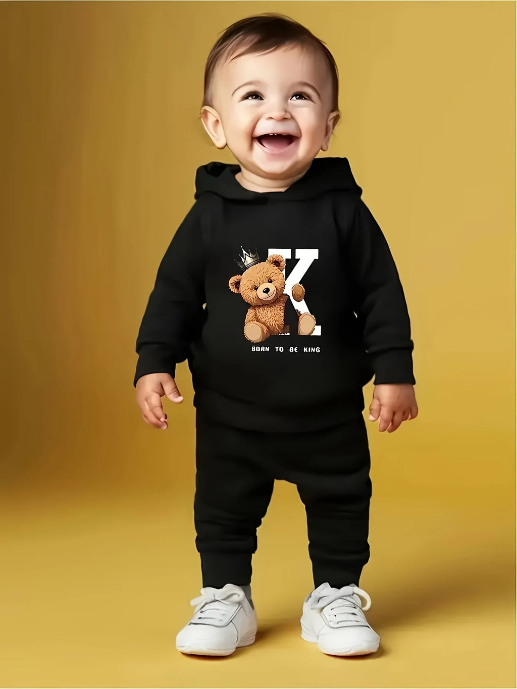 A two-piece cartoon printed fleece hoodie and long pants set for a newborn baby boy in autumn and winter